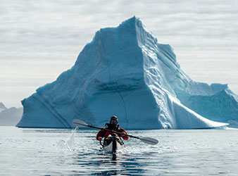Kayak and iceberg